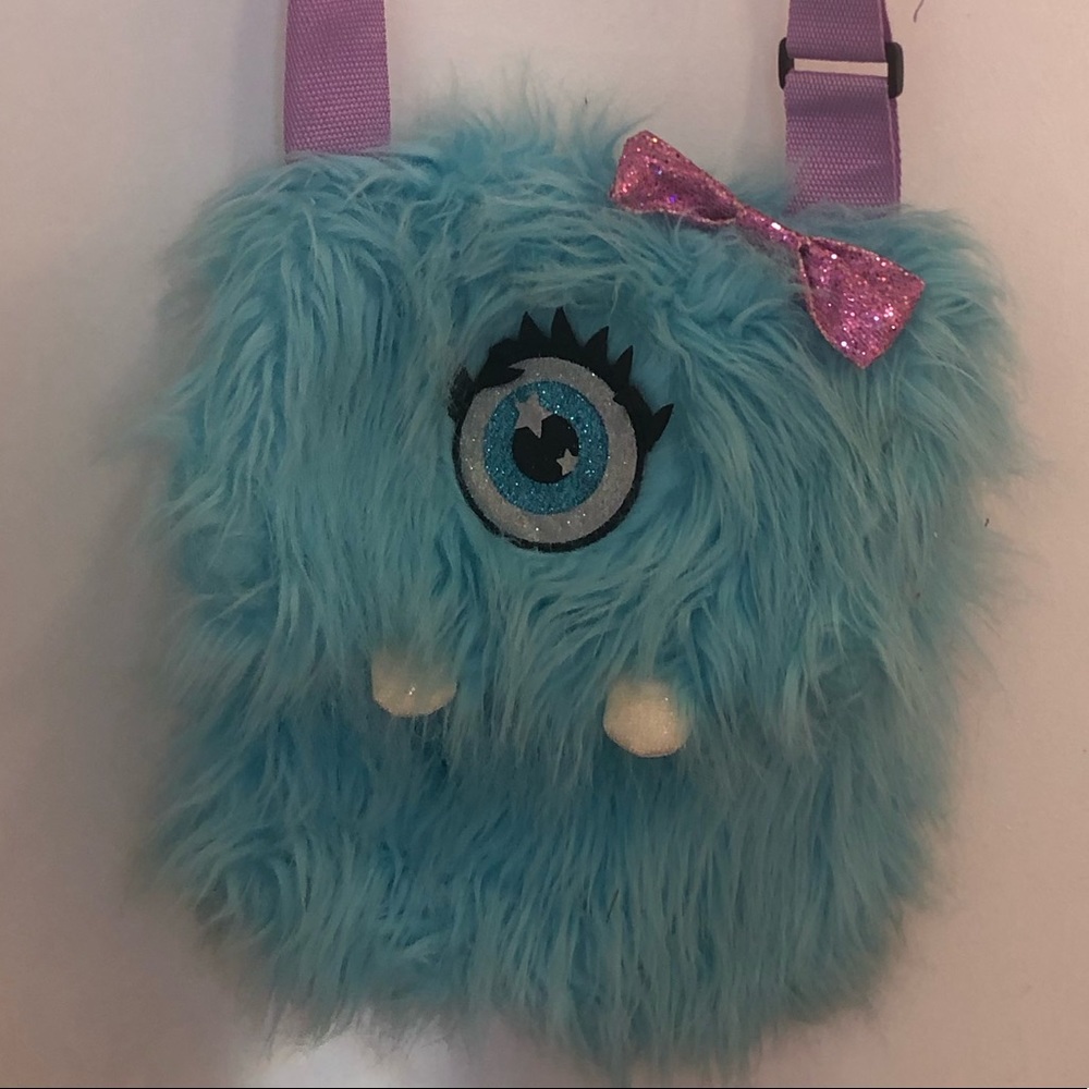 Blue Fuzzy Monster Justice Bag that’s Sparkly